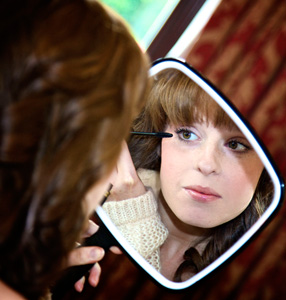 Natural airbrushed makeup in a mirror